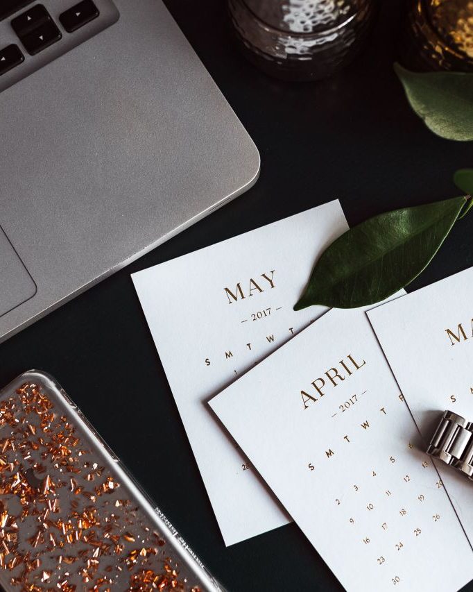 Desk with calendar and laptop
