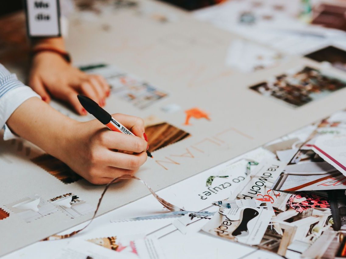 Team planning a brand identity on a design board